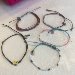 There are five Pura Vida bracelets. They are all either new or gently used.